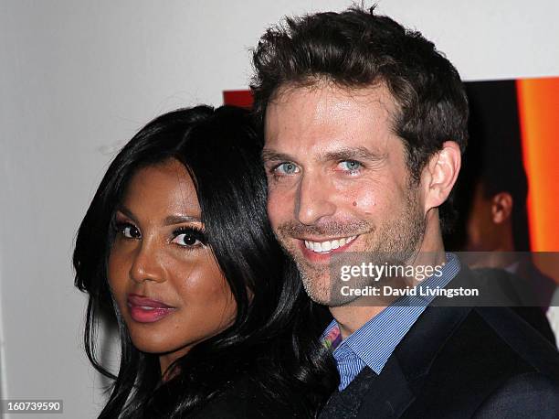 Actors Toni Braxton and David Julian Hirsh attend the premiere screening of "Twist of Faith" at the Stephen S. Wise Temple on February 4, 2013 in Los...