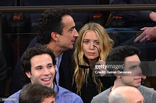 Olivier Sarkozy and Mary-Kate Olsen attend the Detroit Pistons vs New York Knicks game at Madison Square Garden on February 4, 2013 in New York City.