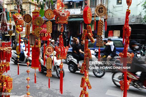 This picture taken on February 4, 2013 shows Chinese decorative hanging items on sale for the lunar new year or Tet celebrations at a Tet market in...