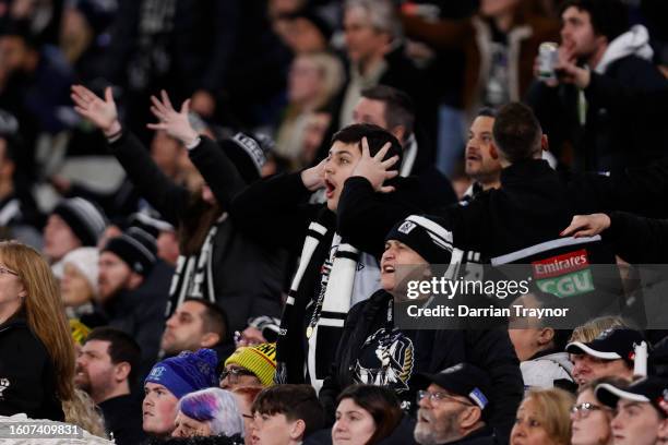 Collingwood fans react during the round 22 AFL match between Collingwood Magpies and Geelong Cats at Melbourne Cricket Ground, on August 11 in...