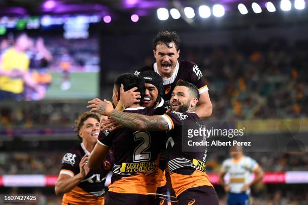Brisbane Broncos celebrate a try during the round 24 NRL match between the Brisbane Broncos and Parramatta Eels at The Gabba on August 11, 2023 in...
