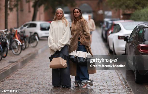 Hanna MW seen wearing brown teddy coat, oversized dark blue jeans, silver bow Loewe sandals and black and white Loewe handbag, Guest seen wearing...