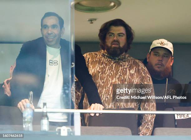 Eddie Betts is seen with Luke Combs during the 2023 AFL Round 23 match between the Collingwood Magpies and the Brisbane Lions at Marvel Stadium on...