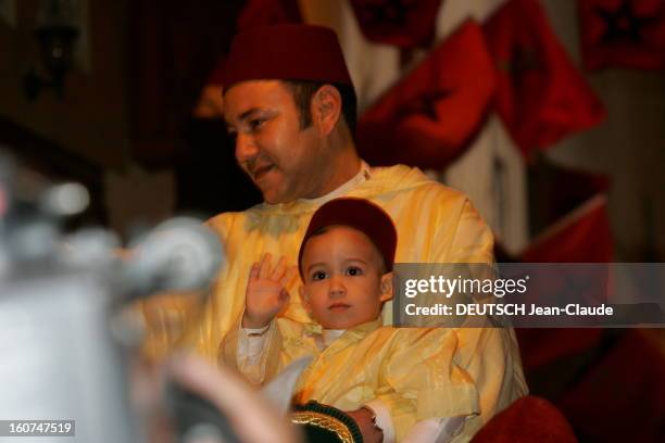 Circumcision Of The Crown Prince Of Morocco. Le roi MOHAMMED VI tenant dans ses bras son fils le prince MOULAY HASSAN saluant, se rendant à cheval au...