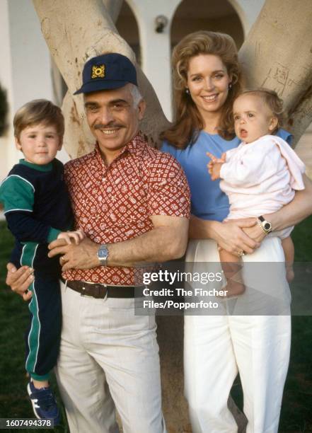 Prince Hamzah, King Hussein , Queen Noor al Hussein and Princess Inman of Jordan at the Royal Palace in Aqaba in Jordan, circa 1984.