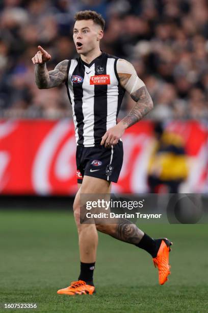 Jamie Elliott of the Magpies celebrates a goal during the round 22 AFL match between Collingwood Magpies and Geelong Cats at Melbourne Cricket...