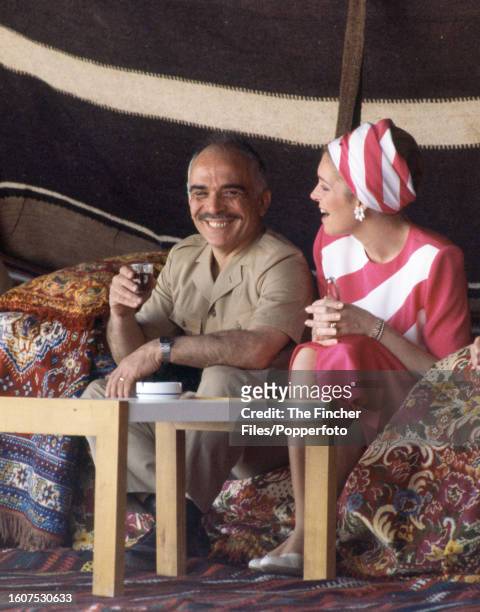 King Hussein of Jordan with his wife Queen Noor al Hussein in a tent at Petra on 27th March 1984.