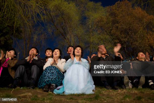 People watch a fireworks display to mark 100 years since the birth of North Korea's founder Kim Il-Sung in Pyongyang on April 15, 2012. North Korea's...