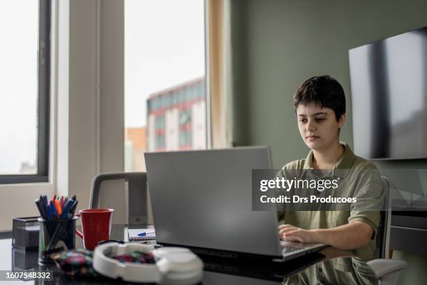 autistic woman working in coworking - autism spectrum stock pictures, royalty-free photos & images