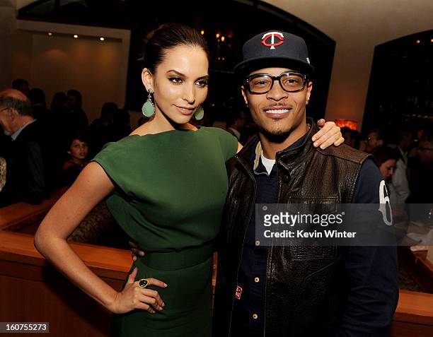 Actress Genesis Rodriguez and actor/rapper T.I. Pose at the after party for the premiere of Universal Pictures' "Identity Thief" at Napa Valley...