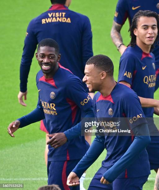 Ousmane Dembélé and Kylian Mbappé of PSG during a Paris Saint-Germain training session at Campus PSG on August 18, 2023 in Poissy, France.