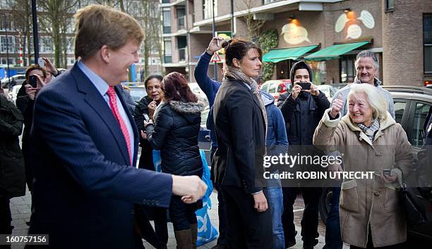 Dutch Prince Willem-Alexander gestures on February 5, 2013 in Rotterdam after visiting a Centrum Voor Dienstverlening center, which helps and...