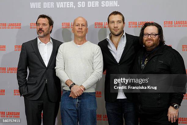 Sebastian Koch, Bruce Willis, Jai Courtney and John Moore attend a photocall for 'Die Hard - 'Ein Guter Tag Zum Sterben' at Hotel Adlon on February...