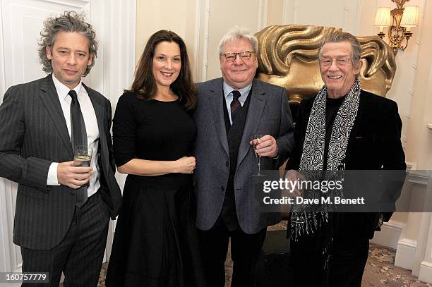 Dexter Fletcher, Barbara Broccoli, Sir Alan Parker and John Hurt attend a drinks reception awarding Sir Alan Parker the BAFTA Fellowship supported by...