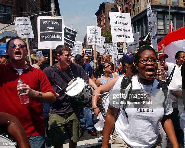 Hundreds of anti sweatshop protesters rally August 7, 2001 in New York City. The rally was part of a new campaign by UNITE to hold retailers...