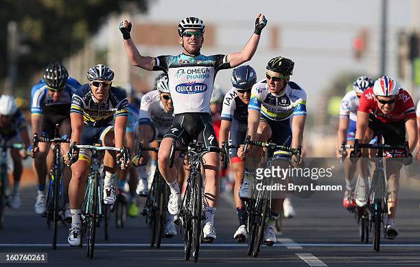 Mark Cavendish of Great Britain and Omega Pharma - Quick Step celebrates winning stage three of the Tour of Qatar from Al Wakra to Mesaieed on...