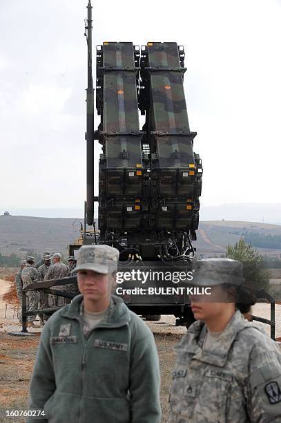 Soldiers stand near a Patriot missile system at a Turkish military base in Gaziantep on February 5, 2013. The United States, Germany and the...