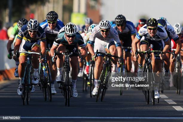 Mark Cavendish of Great Britain and Omega Pharma - Quick Step sprints for the finishline on his way to winning stage three of the Tour of Qatar from...