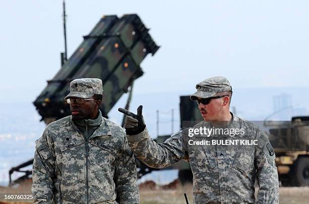 Soldiers stand near a Patriot missile system at a Turkish military base in Gaziantep on February 5, 2013. The United States, Germany and the...