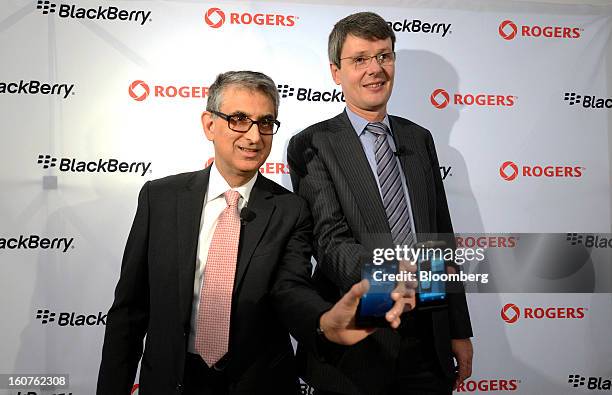 Nadir Mohamed, president and chief executive officer of Rogers Communications Inc., left, and Thorsten Heins, president and chief executive officer...