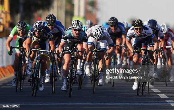 Mark Cavendish of Great Britain and Omega Pharma - Quick Step sprints for the finishline on his way to winning stage three of the Tour of Qatar from...