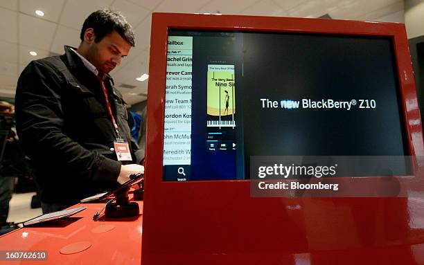 Blackberry Z10 display is seen on a monitor as a member of the media views the device on the first day of sales at a Rogers Communications Inc. Store...