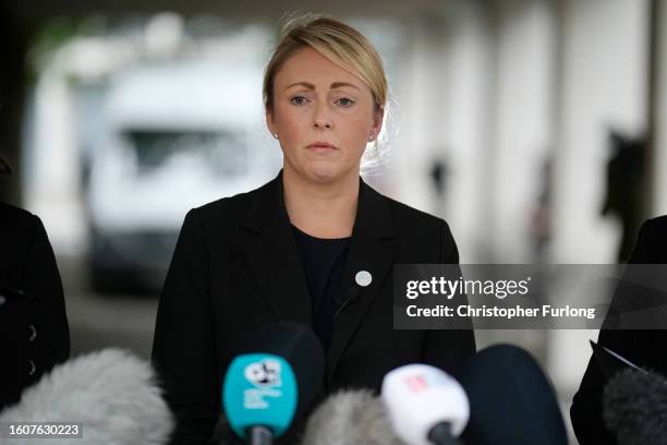 The Deputy Senior Investigating Officer, Detective Chief Inspector Nicola Evans listens after reading out her statement outside Manchester Crown...