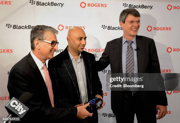 Nadir Mohamed, president and chief executive officer of Rogers Communications Inc., left, and Thorsten Heins, president and chief executive officer...