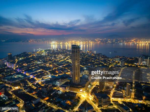 aerial view of komtar towers and old city houses in george town during sunrise in pulau penang. malaysia - george town penang stock pictures, royalty-free photos & images