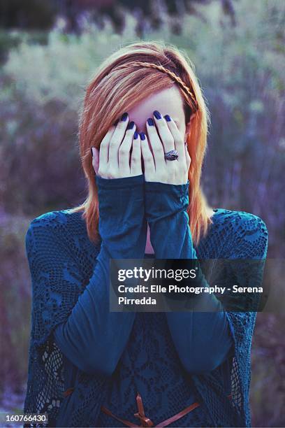 woman with hands over her face - elle women stock pictures, royalty-free photos & images