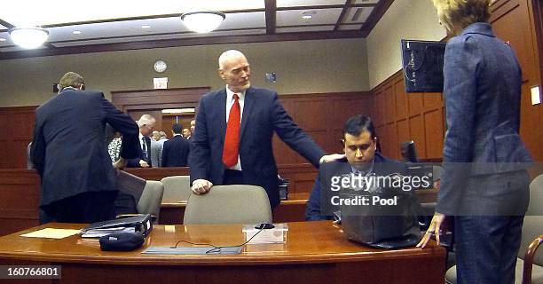 George Zimmerman appears with his attorneys in Seminole circuit court Mark O'Mara, Don West, and Lorna Truett on February 5, 2013 in Sanford,...