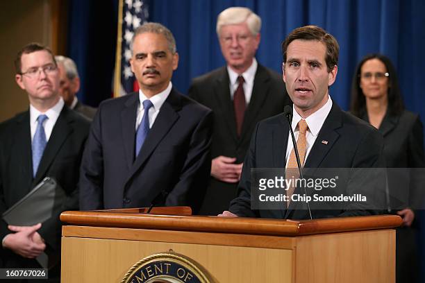 Principal Deputy Assistant Attorney General Stuart Delery, District of Columbia Attorney General Irvin Nathan, U.S. Attorney General Eric Holder,...