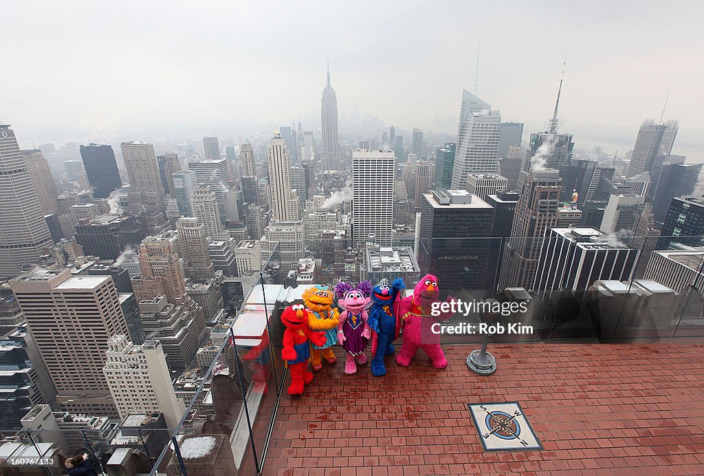 Elmo's Superheroes Visit Top Of Rock