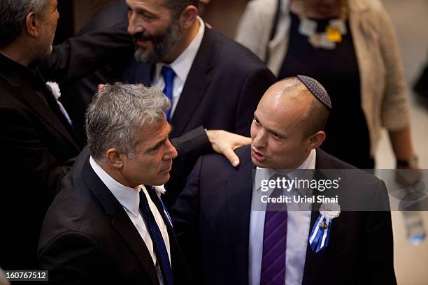 Yair Lapid leader of the Israeli Yesh Atid party and Naftali Bennett, head of Israel's Jewish Home party attend the swearing-in ceremony of the 19th...