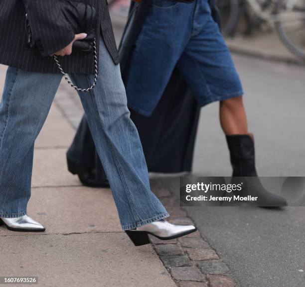 Sonja Leigh seen wearing grey striped blazer jacket, light blue denim pants, black leather belt, black leather bag and Copenhagen Studios CPH246...