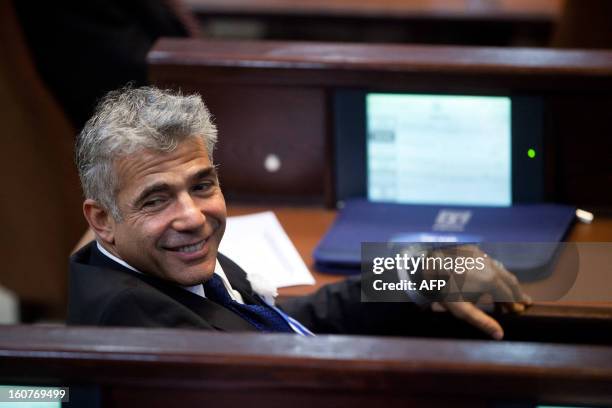 Yair Lapid, leader of the Israeli Yesh Atid party, attends the swearing-in ceremony of the 19th Knesset, the new Israeli parliament, on February 5,...