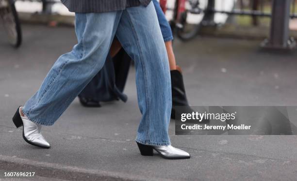 Sonja Leigh seen wearing grey striped blazer jacket, light blue denim pants and Copenhagen Studios CPH246 Vitello Silver leather boots; Amaka...