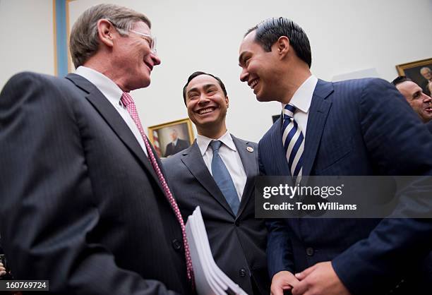 From left, Reps. Lamar Smith, R-Texas, Joaquin Castro, D-Texas, and his brother Julian Castro, mayor of San Antonio, talk before a House Judiciary...