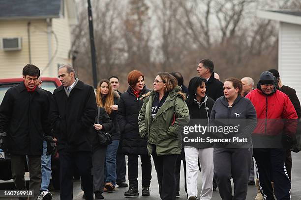 Staten Island residents and members of an Oakwood Beach homeowners association speak with City Council Speaker Christine Quinn in their heavily flood...