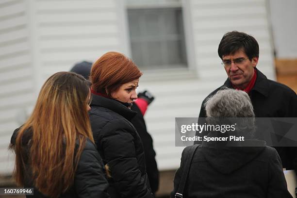 Staten Island residents and members of an Oakwood Beach homeowners association speak with City Council Speaker Christine Quinn in their heavily flood...