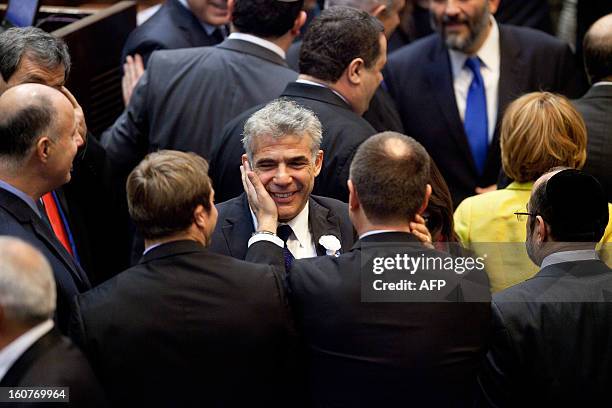 Yair Lapid, leader of the Israeli Yesh Atid party, attends the swearing-in ceremony of the 19th Knesset, the new Israeli parliament, on February 5,...