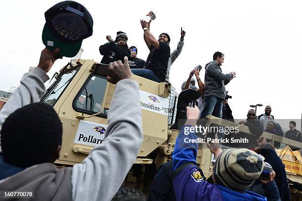 Ose tackle Haloti Ngata of the Baltimore Ravens hold the The Vince Lombardi Trophy as he and teammates celebrate during their Super Bowl XLVII...