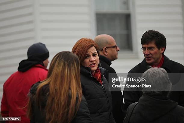 Staten Island residents and members of an Oakwood Beach homeowners association speak with City Council Speaker Christine Quinn in their heavily flood...