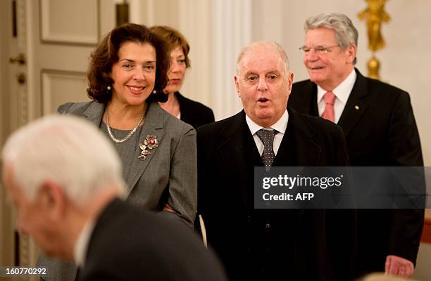 Argentinian- born conductor Daniel Barenboim reacts seeing Former German President Richard von Weizaecker as he walks in with his wife Elena...