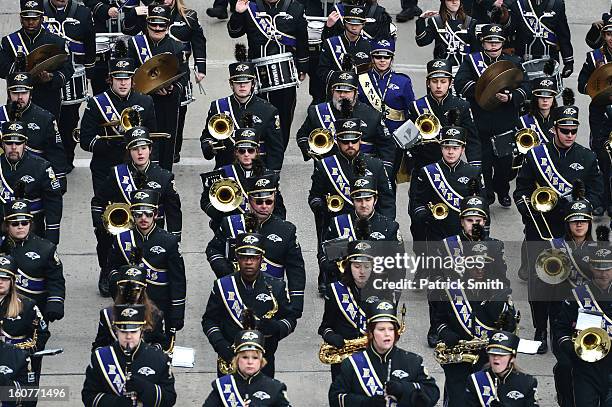The Baltimore Ravens band marches down the street during their Super Bowl XLVII victory parade near M&T Bank Stadium on February 5, 2013 in...