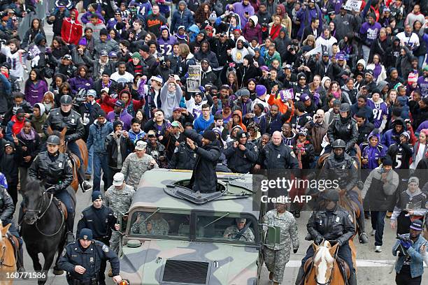 Linebacker Ray Lewis of the Super Bowl champion Baltimore Ravens greets fans as he takes part in the Ravens victory parade in Baltimore, Maryland on...