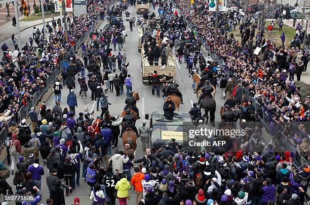 Linebacker Ray Lewis of the Super Bowl champion Baltimore Ravens greets fans as he takes part in the Ravens victory parade in Baltimore, Maryland on...