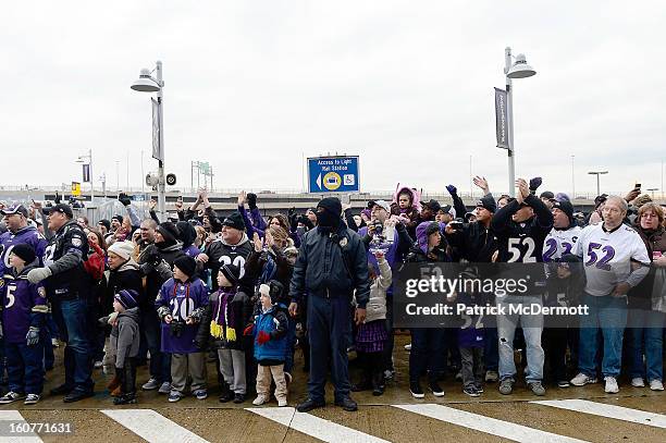 Fans celebrate before the start of the Baltimore Ravens Super Bowl XLVII victory parade at M&T Bank Stadium on February 5, 2013 in Baltimore,...