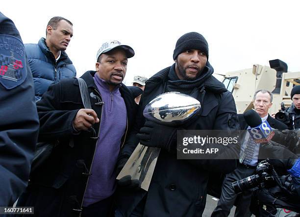 Linebacker Ray Lewis of the Super Bowl champion Baltimore Ravens holds the Vince Lombardi Trophy as he takes part in the Ravens victory parade in...