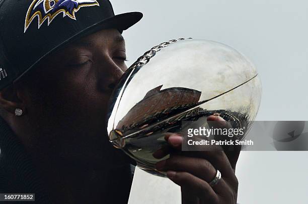 Linebacker Terrell Suggs of the Baltimore Ravens kisses The Vince Lombardi Trophy as he and teammates celebrate during their Super Bowl XLVII victory...